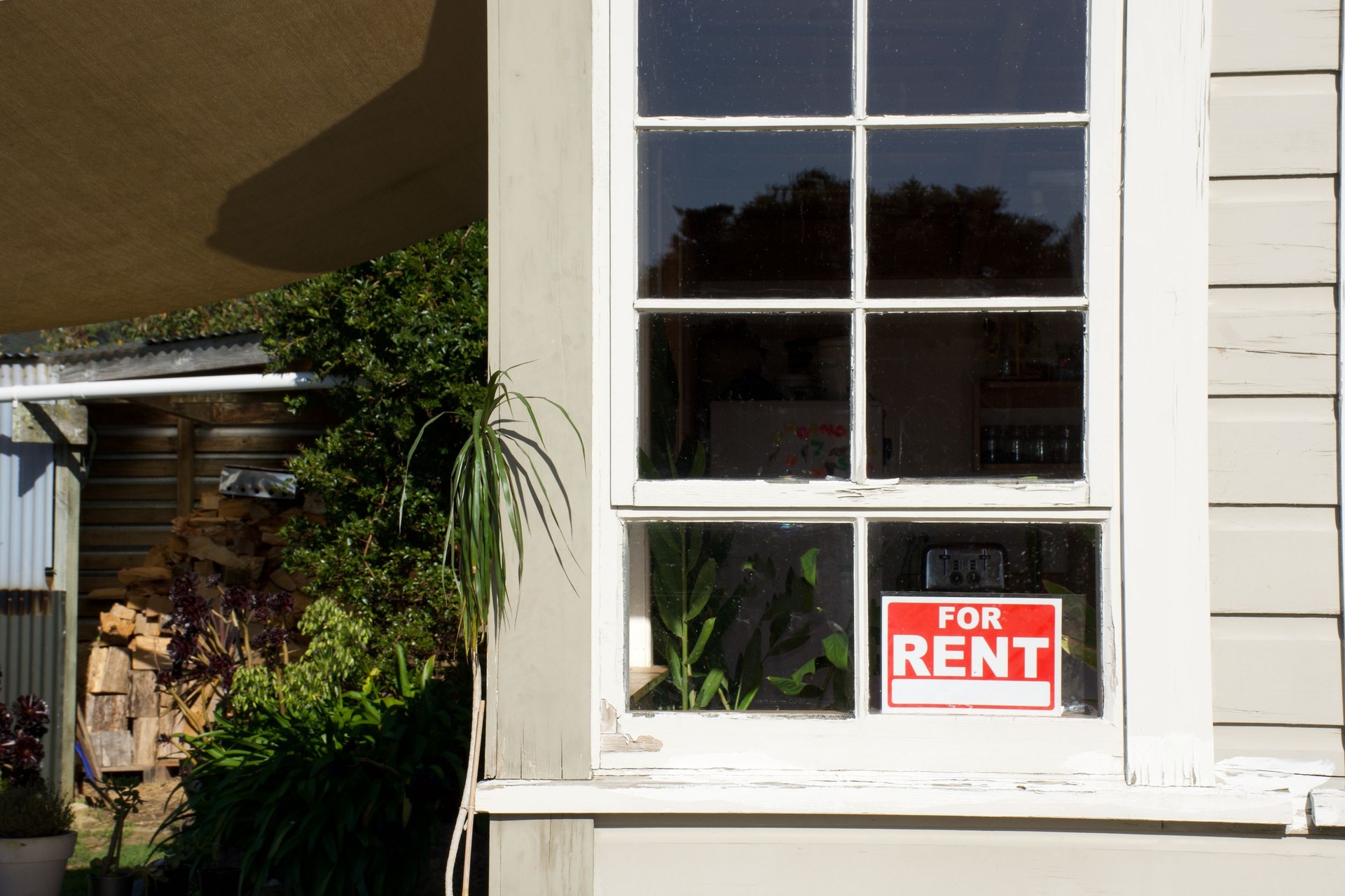 For Rent Sign in House Window